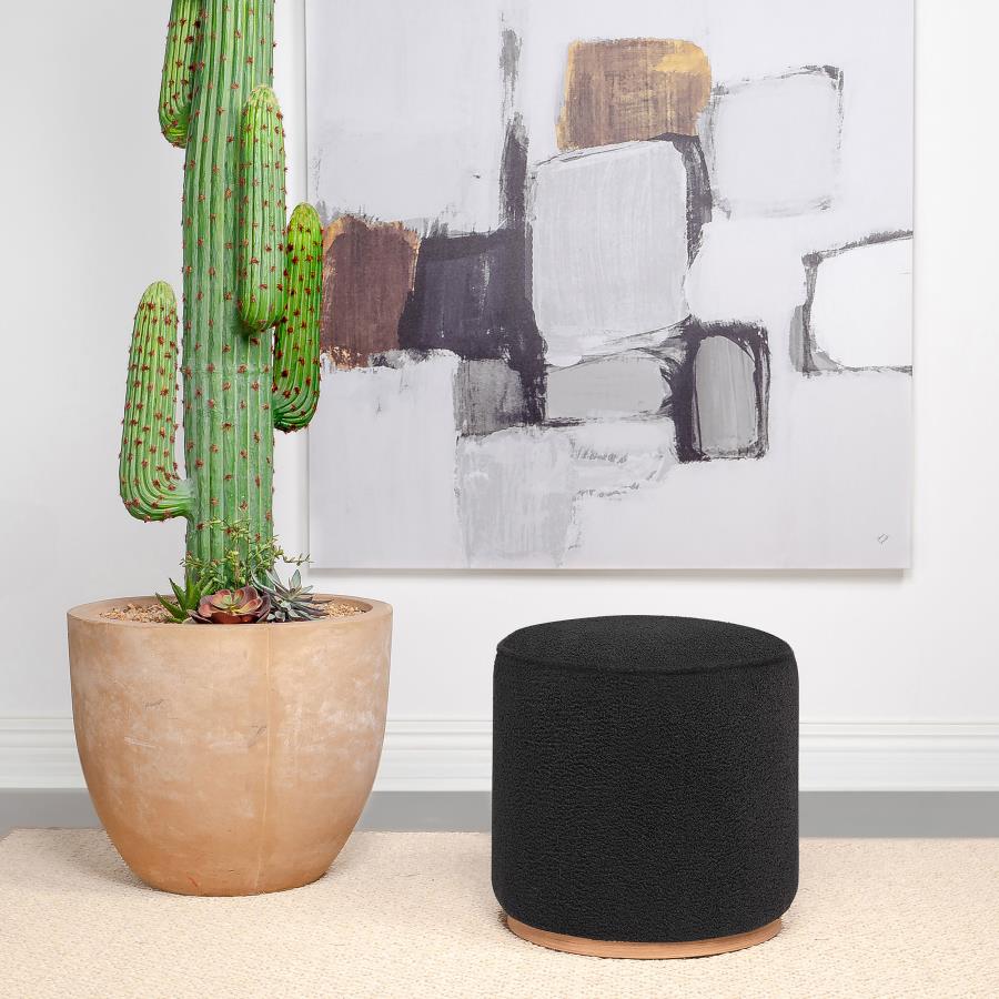 Zena Faux Sheepskin Upholstered Round Ottoman β Black for a Luxurious and Modern Accent Piece